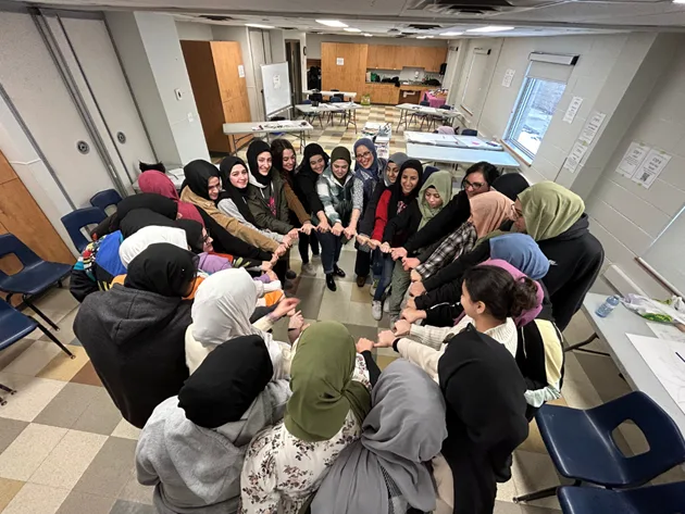 several people standing in a circle