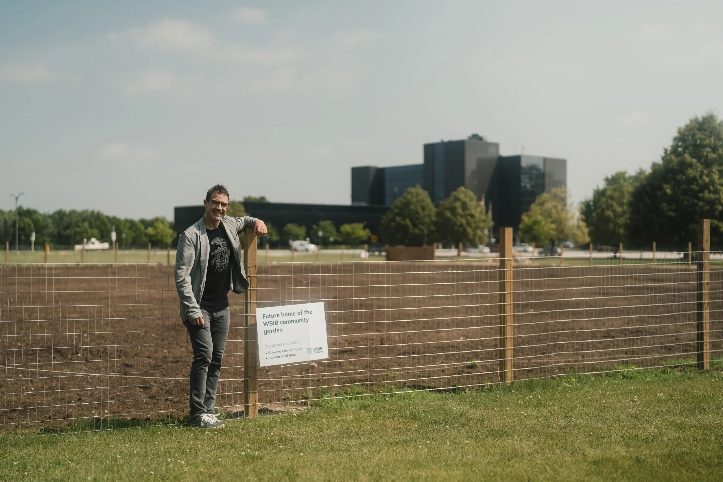 man in front of fence