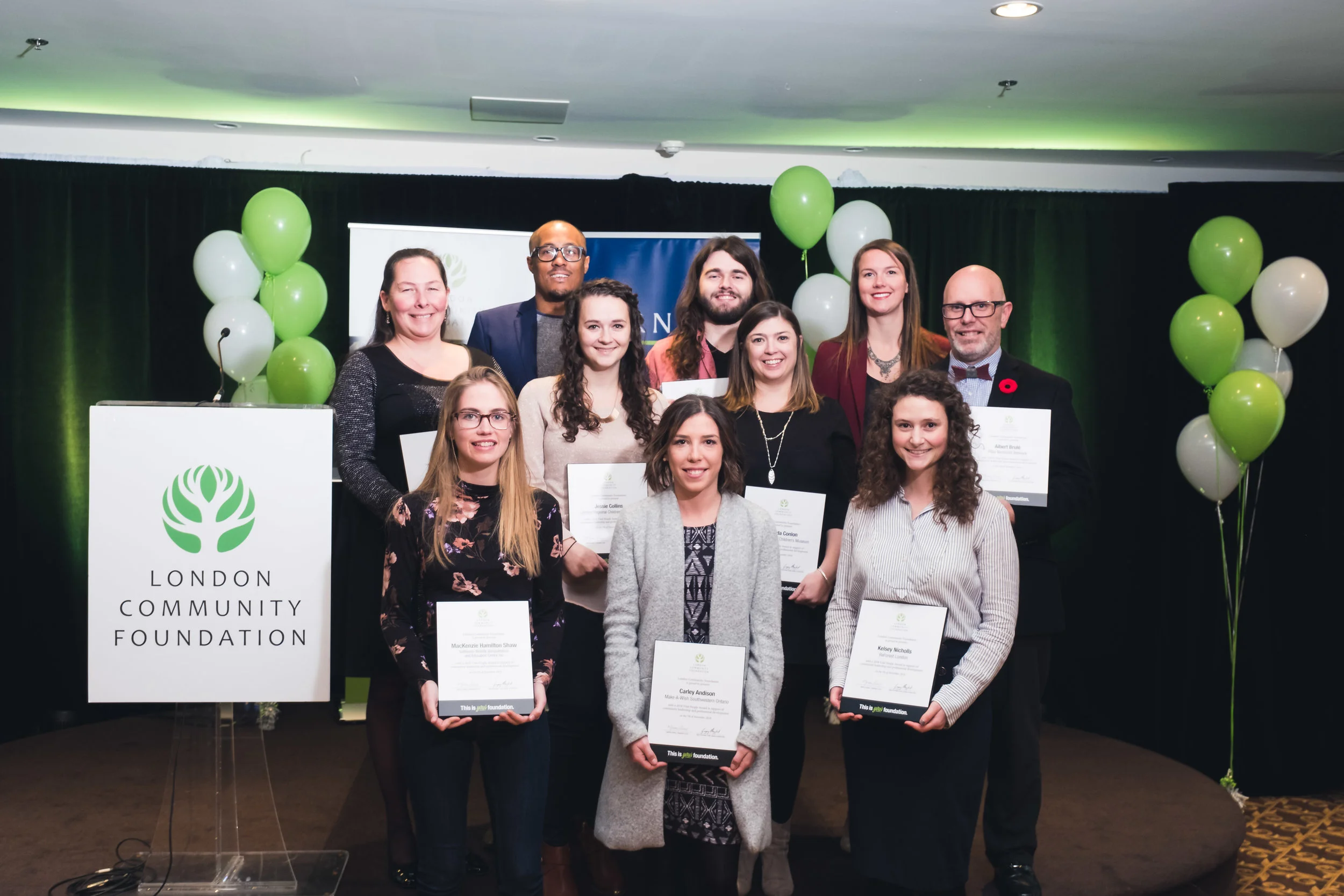London Community Foundation group of people holding award certificates