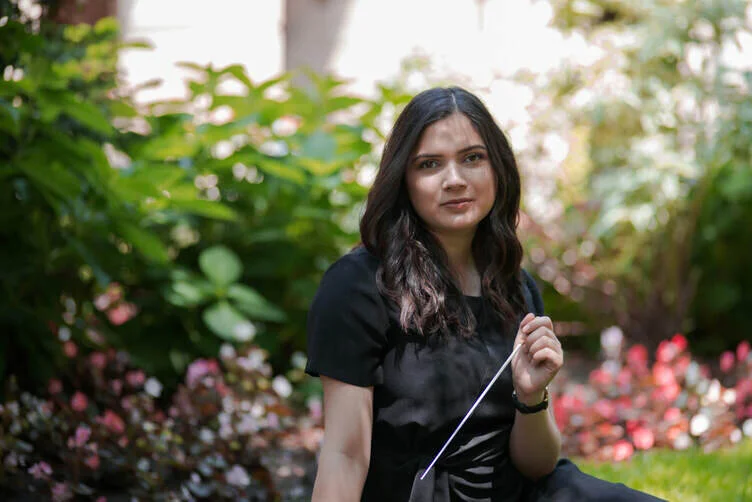 young woman in a flower garden